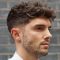 Dark Blonde Curly Taper Fade Haircuts For Guys