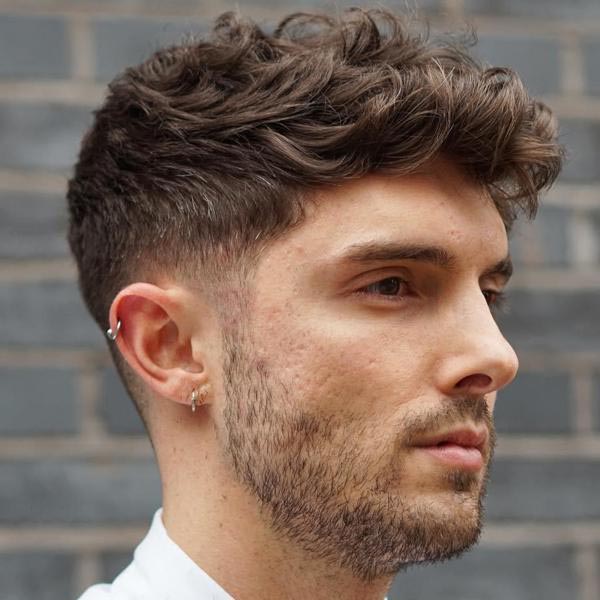 Dark Blonde Curly Taper Fade Haircuts For Guys